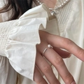 Minimalist 925 sterling silver open ring featuring a white pearl on a finger - Simple Open Pearl Ring