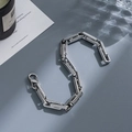 Detail of silver stainless steel chain bracelet with textured links and lobster clasp - gf131-8mm Striped Texture