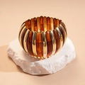 Detail of acrylic stretch bracelet with amber resin plates and gold metal spacers - Dark Coffee
