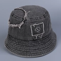 Close-up of distressed denim bucket hat featuring letter embroidery and frayed fringe edges - M(56-58cm) / Gray
