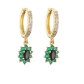 Close-up of gold hoop earrings with green zircon flower charm and black oval center stone - Black and Green