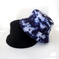 Detail view of cotton bucket hats in classic black and blue-white tie-dye patterns - Adult 55-58cm / Blue & White Tie-Dye