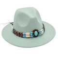 Detail of mint green fedora hat featuring a turquoise gemstone and boho beaded band - One Size / Mint Green