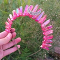 Detail of pink crystal pillars and silver moon pendant on a Wicca bohemian headband - AB Red + White K Moon