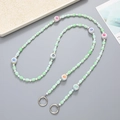 Detail of light green and white acrylic beaded phone strap with colorful numeric charms - Crossbody Chain / Green