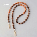 Détail chaîne de perles acryliques 120cm avec perles ovales marron orange et fermoirs dorés - Marron / 120cm