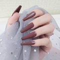 Detail of long coffin-shaped glossy dark mocha brown press-on nails with shiny UV finish - Dark Plum Brown (CBLL-23)