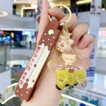 Cartoon star-shaped milk tea keychain with brown bear floating in yellow liquid - Pearl Milk Tea Bear-Five-Pointed Star