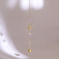 Close-up of golden sun face charm and natural purple crystal stones on a boho wind chime - Style 3-Triple Ring Sun Amethyst Pendant
