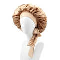 Champagne gold satin sleep cap with wide elastic ribbon band shown on a model head - Gold