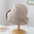 Close-up of beige wide-brim sun hat with check texture and bow tie detail - M(56-58cm) / Khaki