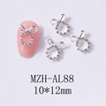 Dettaglio decorazione unghie fiocco argento con strass e anello vuoto 10x12mm - Stile Fiocco con Strass Argento (AL88)