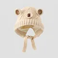 Close-up of beige knit bear ear beanie for kids showing warm lining and chin straps - 3-8 Years / Beige