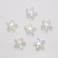 Macro shot of six transparent holographic starfish charms for DIY jewelry making - AB White