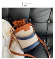 Detail of trendy color-block bucket bag in beige canvas and blue leather with drawstring - Canvas Patchwork Bucket Bag (XQD21121) / Blue
