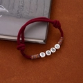 Red braided rope bracelet with four silver beads engraved with peace and joy symbols - L404 Peace and Joy