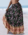Detail of high waisted bohemian floral maxi skirt showing vintage hem print on beach - S / Black with Pink Floral