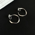 Macro detail of silver twisted hoop clip-on earrings with soft anti-pain pads - Clip-on Style / 3cm / Silver