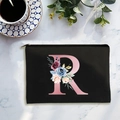 Black canvas cosmetic bag with pink letter R and floral pattern with gold zipper - Letter R