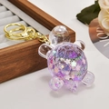 Purple glitter turtle keychain with cherry blossom sequins and gold lobster clasp - Sparkling Purple