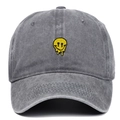 Close-up of yellow melting smiley face embroidery on a grey washed cotton baseball cap - Adjustable / Gray