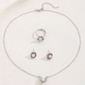 Silver jewelry set with necklace, floral pearl earrings and ring on beige texture - Silver Pearl Flower 3-Piece Set (Necklace+Earrings+Ring)