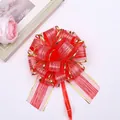 Red gift pull bow with gold edges and bark texture for festive gift packaging - Red
