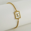 Minimalist gold-plated stainless steel bead chain bracelet featuring a shell letter K pendant - Letter K