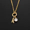 Élégant collier en acier inoxydable plaqué or 14K avec initiale K et pendentif cristal - Lettre K