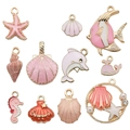 Pink and gold enamel ocean charms set with starfish, shell, and dolphin for DIY jewelry - 12-Piece Ocean Series Set