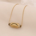 Collar dorado ojo del mal con grabado WILL y esmalte sobre fondo de tela beige - Negro