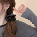Elegant black satin pleated hair scrunchie with woven tag on a brunette ponytail - Black (18# Scrunchie-Black-Width 9cm)