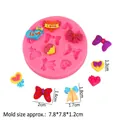 Pink silicone mold for bow and heart shapes, measuring 7.8x7.8cm for cake baking - Bowknot Heart (A875) / Pink