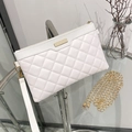White quilted faux leather clutch bag with golden chain strap and wristlet on glass - White