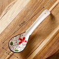 Ceramic spoon with red floral pattern on wood background, dimensions 15.5cm by 4.5cm - Red Rich Floral