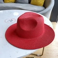 Classic bright red fedora straw hat with woven spiral texture for summer beach vacation - Red