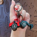 Mini red excavator construction toy keychain with metallic black ring and clasp charm - Red Excavator