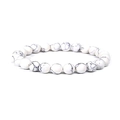 Detailed view of 8mm white turquoise beads with natural black veins on elastic bracelet - Howlite