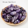 Macro view of natural Dream Amethyst stones with purple texture in a wooden tray - 100g/Pack / Amethyst