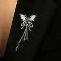 Silver butterfly brooch with black gemstone and fringe chains on a black suit lapel - Fluid Butterfly Tassel Chain