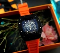 Skeleton mechanical watch with black tonneau case and vibrant orange silicone strap - Black Case Orange Strap