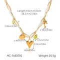 Detail view of shell and heart charms on a gold silk scarf necklace with dimensions - Heart Dolphin Pendant Style (HC-N40591)
