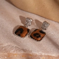 Macro detail of silver square leopard print earrings with hammered metal texture - Leopard Square Drop Earrings (Silver Needle)
