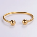 Gold cable twist open cuff bracelet with two polished beads at the ends for women - Gold