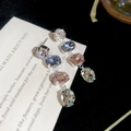Macro shot of silver drop earrings featuring colorful oval gemstones and claw settings - Silver Needle Multi-color Jewelry Set (Earrings + Necklace)
