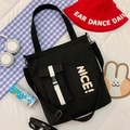 Large black canvas tote bag with NICE lettering and adjustable shoulder straps - Black