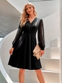 Elegant black V-neck dress with polka dot sheer mesh sleeves on a white spiral staircase - S / Black