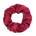 Close-up of burgundy satin scrunchie with silky texture and elegant pleat details - Burgundy