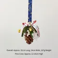 Christmas hanging ornament with pine cone, green needles, bell, and white snowflake - Natural Pinecone D