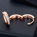 Detail of rose gold hoop earrings with square CZ zircons showing the hinge opening mechanism - E277-Square Cut / Rose Gold